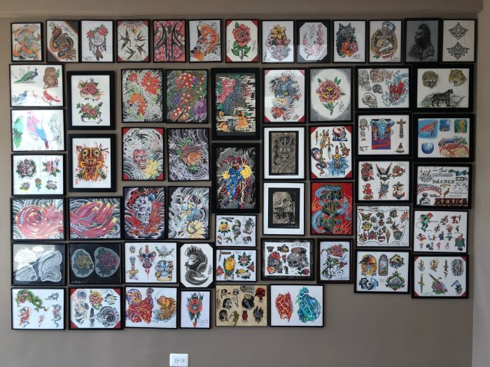 tattoo shop wall of flash and other art prints